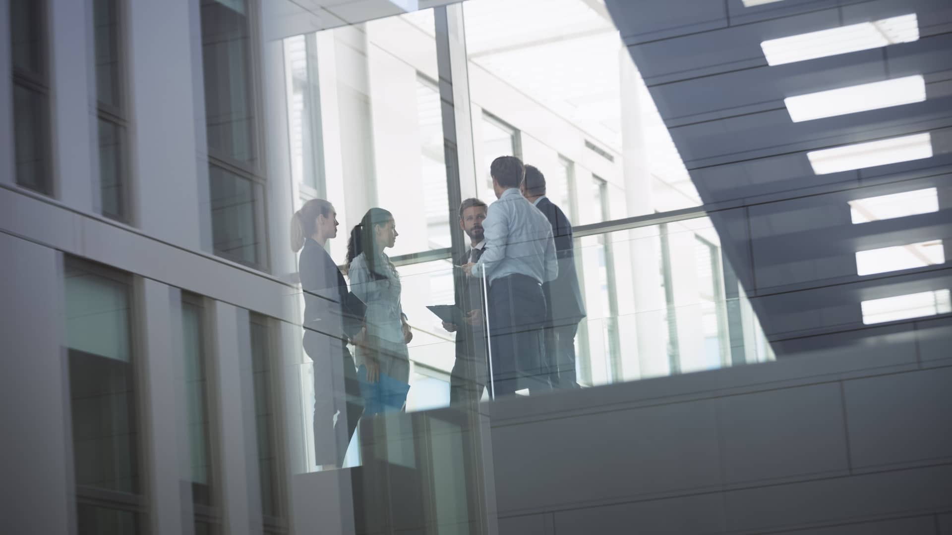 businesspeople-interacting-inside-office-building (1) (1) (1)